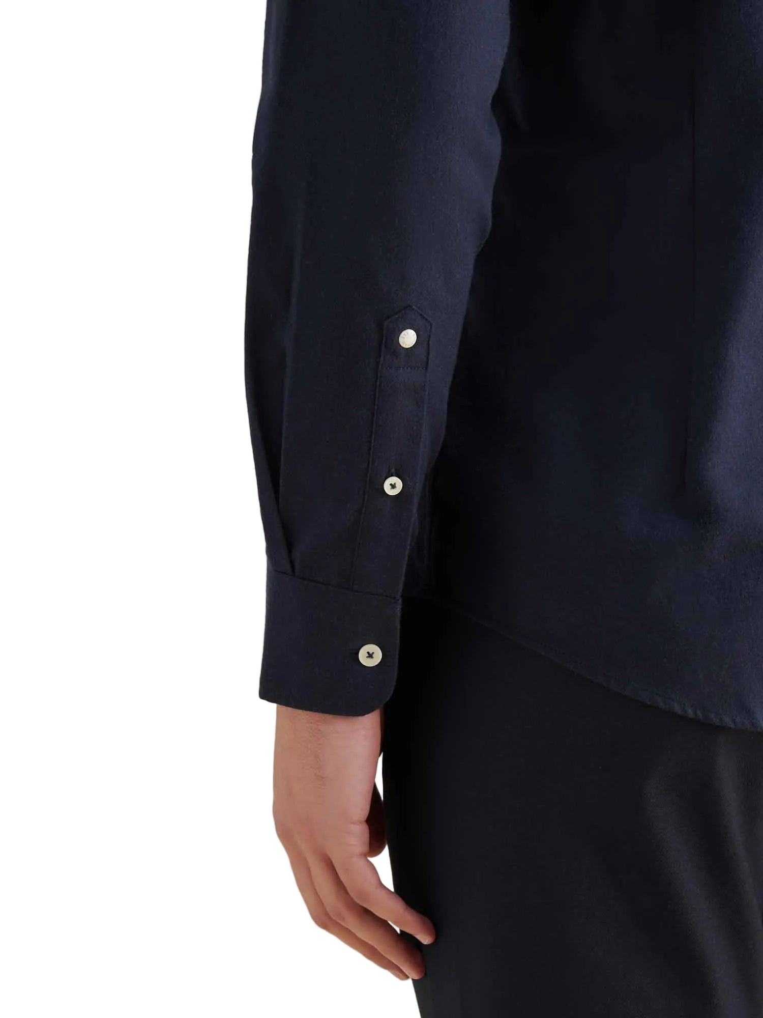 Navy blue shirt with button details on a white background